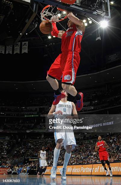Blake Griffin of the Los Angeles Clippers dunks the ball over Danilo Gallinari of the Denver Nuggets at Pepsi Center on April 18, 2012 in Denver,...