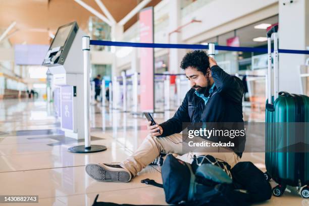 man lost his flight - airport frustration stock pictures, royalty-free photos & images