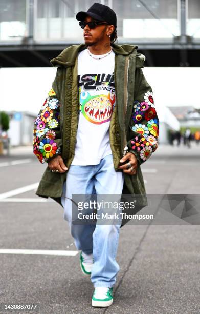 Lewis Hamilton of Great Britain and Mercedes walks in the Paddock during previews ahead of the F1 Grand Prix of Japan at Suzuka International Racing...