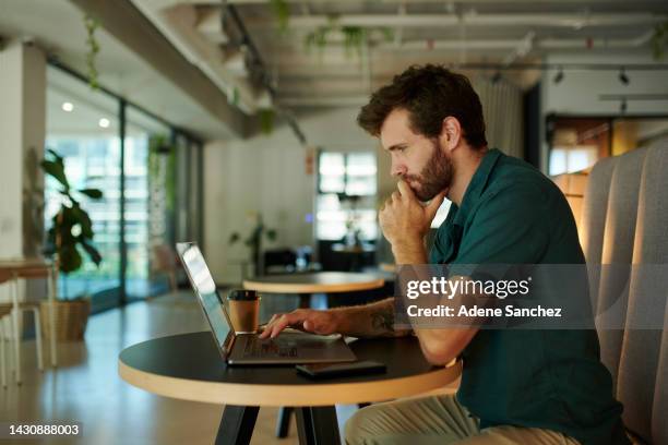 business, laptop and businessman working in a restaurant, cafe or coffee shop for internet connection. remote entrepreneur or small business owner thinking of idea on a computer in a dark workspace - ciber café imagens e fotografias de stock