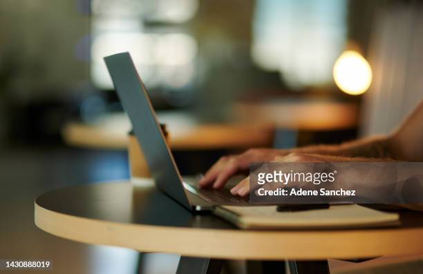 hands typing, research and laptop with man working remote while writing an email for communication while sitting at a table inside. online planning, web search and internet browsing with male writer - internet search stock pictures, royalty-free photos & images