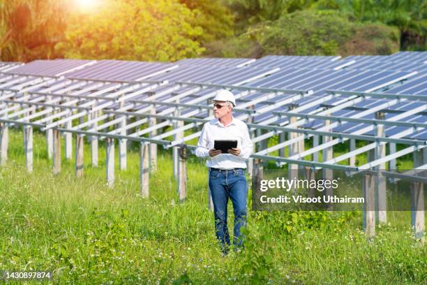 engineer checking the solar panel,technology solar cell,solar farm. - roof replacement stock pictures, royalty-free photos & images