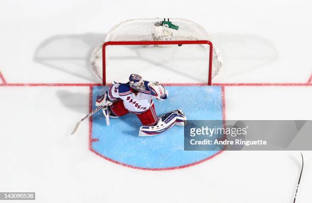 Henrik Lundqvist of the New York Rangers allows the overtime game-winning goal into the net against the Ottawa Senators in Game Four of the Eastern...