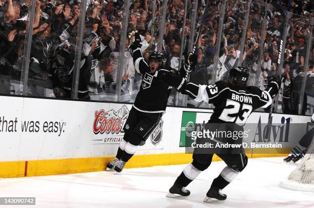 Anze Kopitar and Dustin Brown of the Los Angeles Kings react after Kopitar's goal against the Vancouver Canucks in Game Four of the Western...
