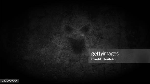 foggy horror midnight view, blank spooky scary dark grey black gradient color halloween theme background with one abstract ghost silhouette like graffiti on a scratched cracked old wall - good evil stock illustrations
