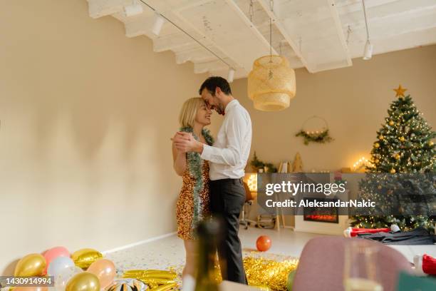 slow dance on intimate new year's eve party - slow dancing stock pictures, royalty-free photos & images