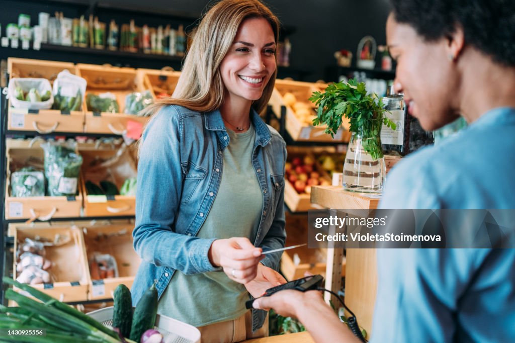 Customer paying bill using a credit card.