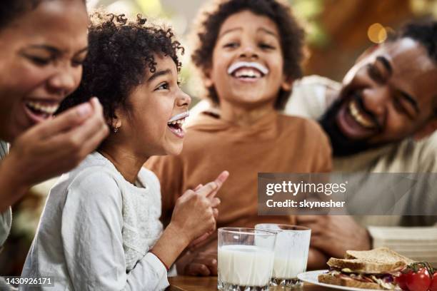 we both have milk mustache! - milk family stock pictures, royalty-free photos & images