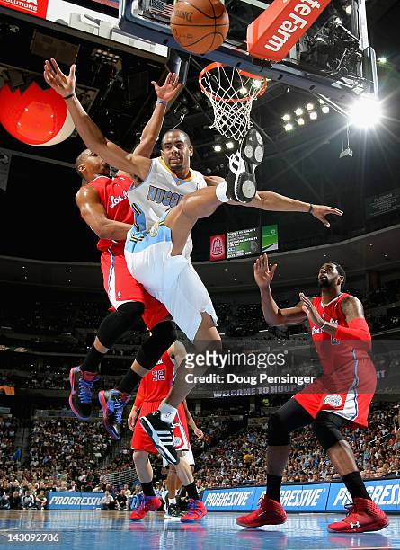 Arron Afflalo of the Denver Nuggets looses control of the ball against Randy Foye of the Los Angeles Clippers at Pepsi Center on April 18, 2012 in...