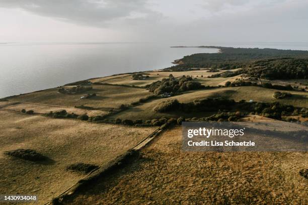 aerial view taken by drone of the countryside at the ocean - beach denmark stock pictures, royalty-free photos & images