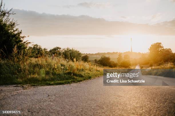 scenic view of landscape against sky during sunset - denmark road stock pictures, royalty-free photos & images