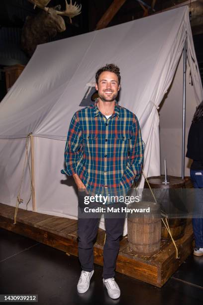 Actor Dylan Efron wears a Filson Deer Island Jac-Shirt during the Filson 125 years of legacy and tradition celebration on October 05, 2022 in...