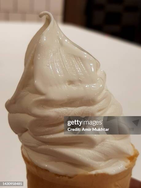 closeup of vanilla cone ice cream. - softeis stock-fotos und bilder