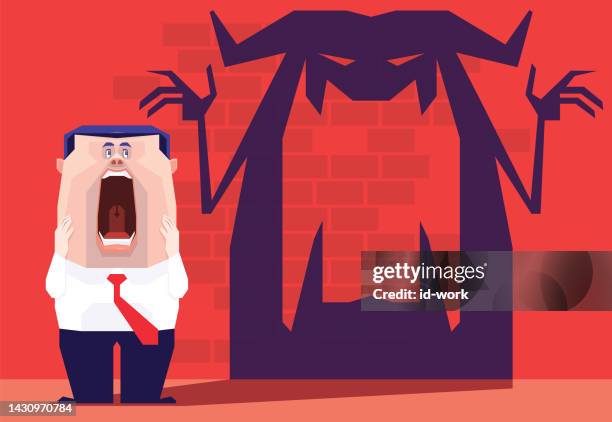 screaming businessman with angry devil shadow - evil shadow stock illustrations