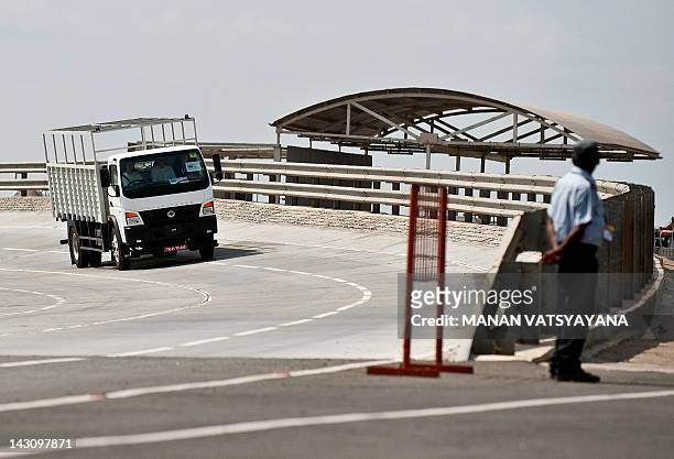 Bharat Benz truck is driven on a test track at the Daimler India Commercial Vehicles Plant at Oragadam in Chennai on April 18, 2012. The German...