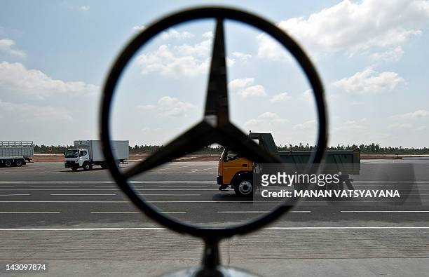 Mercedes-Benz logo is seen as a Bharat Benz truck is driven on a test track at the Daimler India Commercial Vehicles Plant at Oragadam in Chennai on...