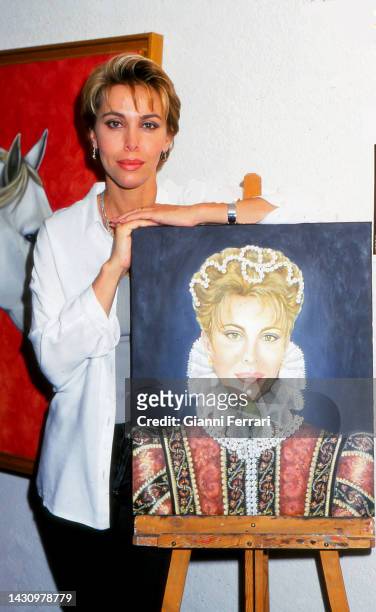 Carla Duval with a painting, Madrid, Spain, 1999.