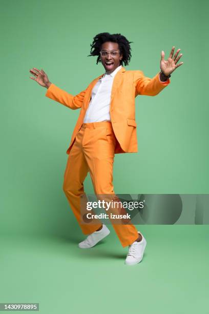 portrait of excited elegant man - model pose full body stockfoto's en -beelden
