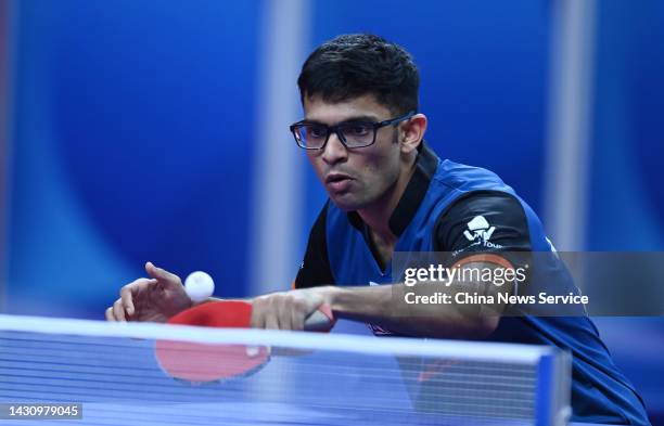 Shah Manush Utpalbhai of India competes against Wang Chuqin of China during the Men's Round of 16 match between China and India on Day 7 of 2022 ITTF...