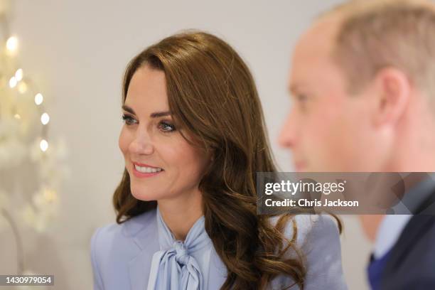 Catherine, Princess of Wales and Prince William, Prince of Wales speak with staff and counsellors during their visit to the PIPS charity on October...