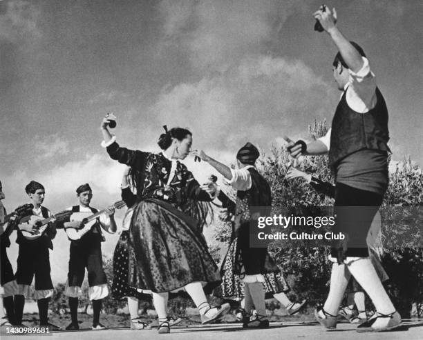 Jota dance of Aragon. Performed by folk dancers from Saragossa in regional cotume. Using castanets. Partner dance. Photographer not known from 1950s...