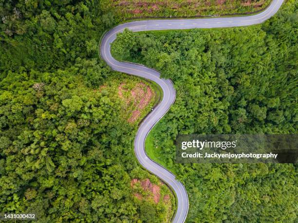 beautiful curved road known on the high mountain in nan province, thailand. - road top view stock pictures, royalty-free photos & images