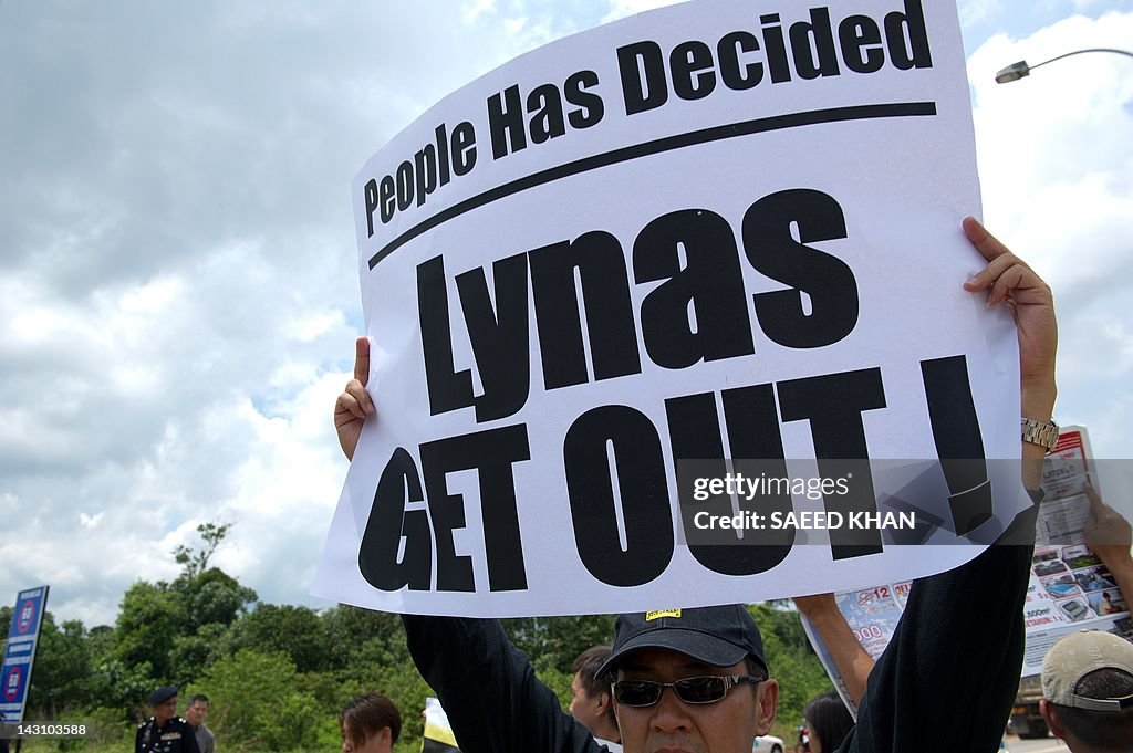 An anti-Lynas activist holds a placard a