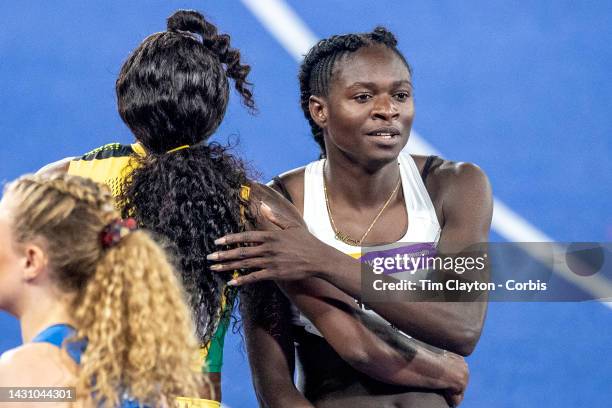 Elaine Thompson-Herah of Jamaica after winning the gold medal in the Women's 200m Final is congratulated by Christine Mboma of Namibia during the...