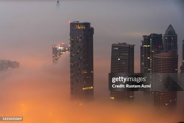 An Aerial View of the Dubai Skyline during Foggy Morning taken on in Dubai, United Arab Emirates