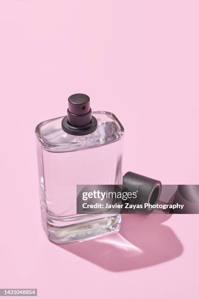 liquid sprayer on pink background - new pink background stock pictures, royalty-free photos & images