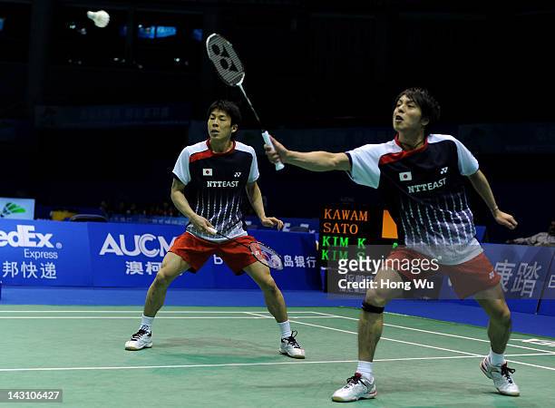 Naoki Kawamae and Shoji Sato of Japan play a shot during their match against Kim Ki Jung and Kim Sa Rang of Korea during day Three of the 2012...