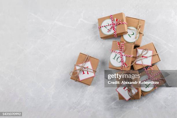 christmas calendar. christmas gift on white marble background. copy space, top view - child with advent calendar stock pictures, royalty-free photos & images