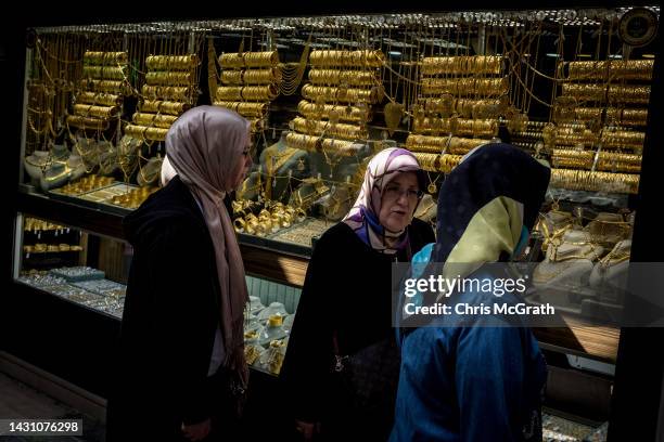 Women look at a gold store in Istanbul's Grand Bazaar, on October 06, 2022 in Istanbul, Turkey. As Turkey's inflation continues to soar and the...