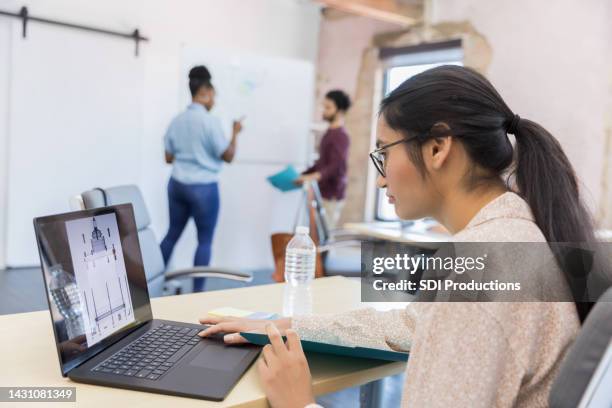 engineering student works on her project - cad drawing stock pictures, royalty-free photos & images