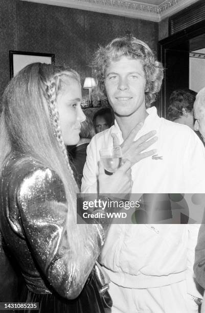 Photographer Arnaud de Rosnay and American windsurfer Jenna Severson. Event took place at Regine's Paris nightclub.