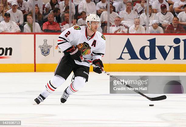 Duncan Keith of the Chicago Blackhawks skates with the puck against the Phoenix Coyotes in Game One of the Western Conference Quarterfinals during...