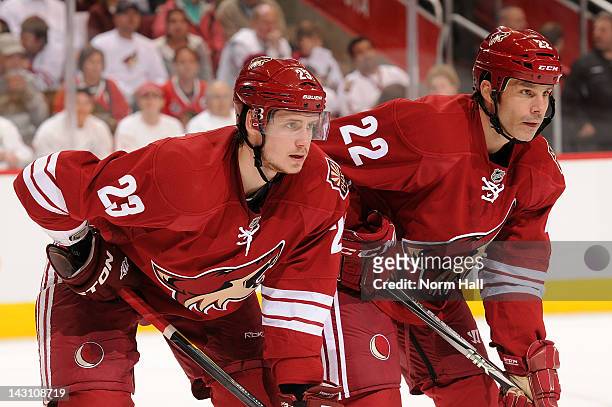 Oliver Ekman-Larsson and Daymond Langkow of the Phoenix Coyotes get ready during a faceoff against the Chicago Blackhawks in Game One of the Western...