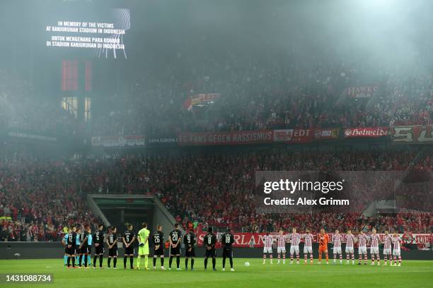 Players, staff, officials and fans take part in a moment of silence in memory of the victims of the tragic events at Kanjuruhan Stadium in Indonesia...