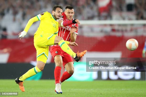 Pedro Chirivella of FC Nantes is challenged by Maximilian Eggestein of SC Freiburg during the UEFA Europa League group G match between Sport-Club...