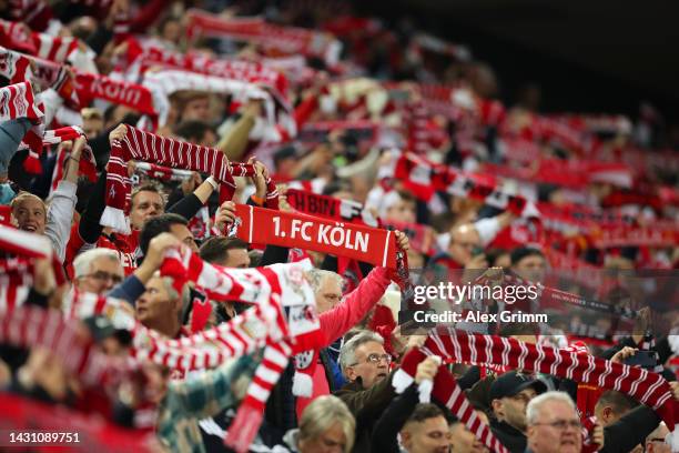 Fans of 1.FC Köln hold their scarves up prior to kick off of the UEFA Europa Conference League group D match between 1. FC Köln and FK Partizan at...