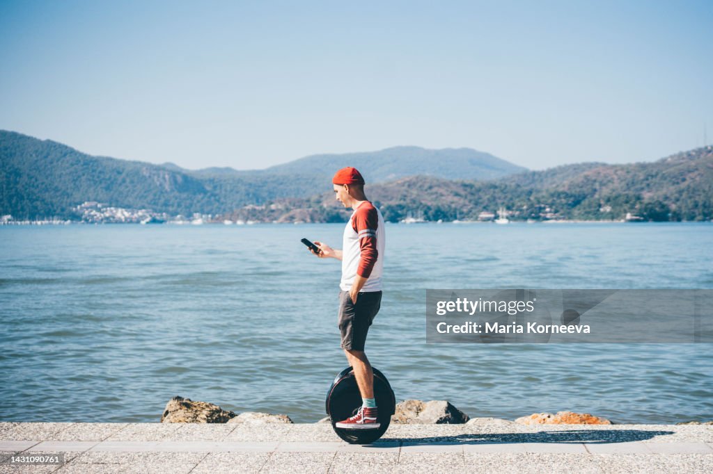 Man riding electric unicycle.