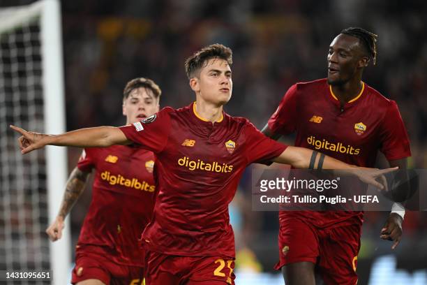 Paulo Dybala of AS Roma celebrates scoring their side's first goal from a penalty with teammates during the UEFA Europa League group C match between...