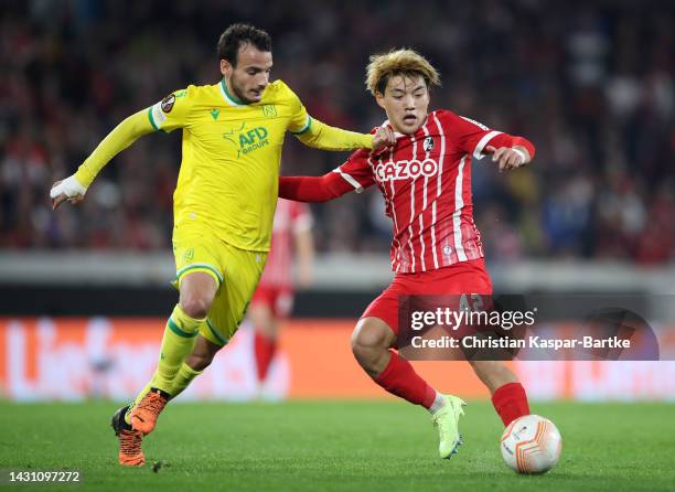 Pedro Chirivella of FC Nantes challenges Ritsu Doan of SC Freiburg during the UEFA Europa League group G match between Sport-Club Freiburg and FC...