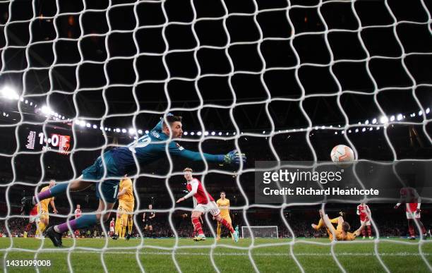 Rob Holding of Arsenal scores their team's second goal past Nikita Khaikin of FK Bodo/Glimt during the UEFA Europa League group A match between...