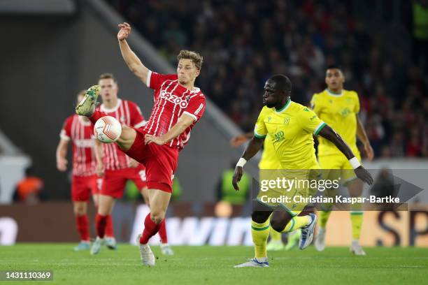 Yannik Keitel of SC Freiburg is challenged by Moussa Sissoko of FC Nantes during the UEFA Europa League group G match between Sport-Club Freiburg and...