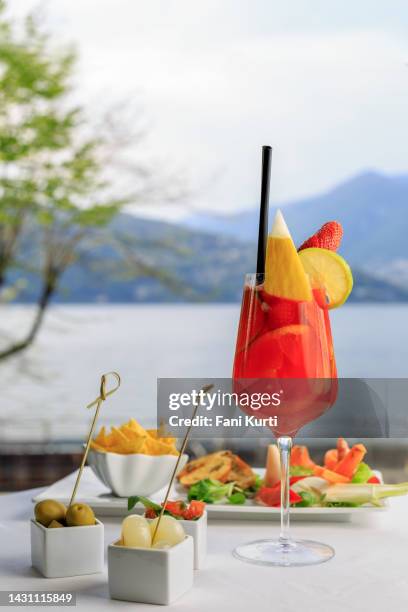 cocktails and finger food aperitif by the lake - italy beer stock pictures, royalty-free photos & images