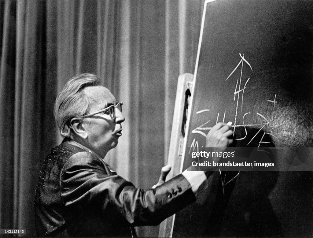 Austrian psychologist Viktor Frankl giving a lecture. Photograph. About 1970.