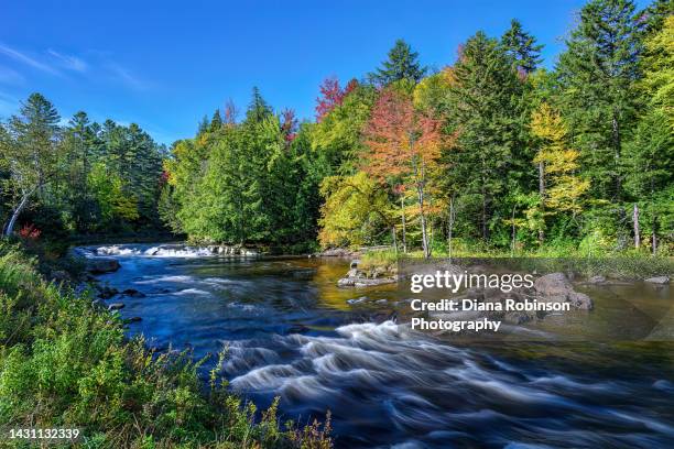 water flowing in the ausable river near lake placid, new york in the high peaks area of the adirondacks - lake placid stock pictures, royalty-free photos & images