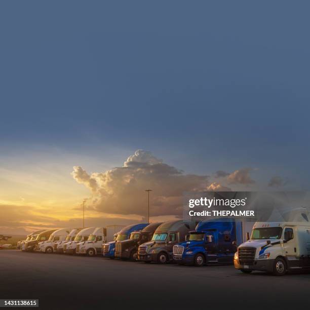 semi trucks parked on a resting station in texas, usa  at sunset - articulated lorry stock pictures, royalty-free photos & images