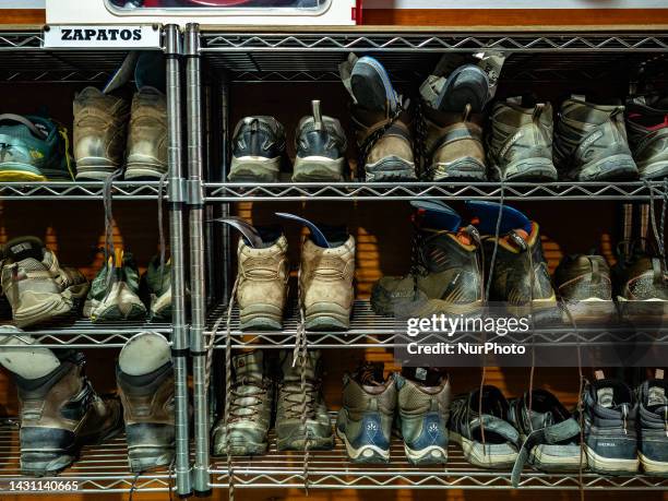 Tons of hiker boots and sneakers are seen placed on a shelf in a pilgrim shelter close to Santiago. On June 1st in Spain.